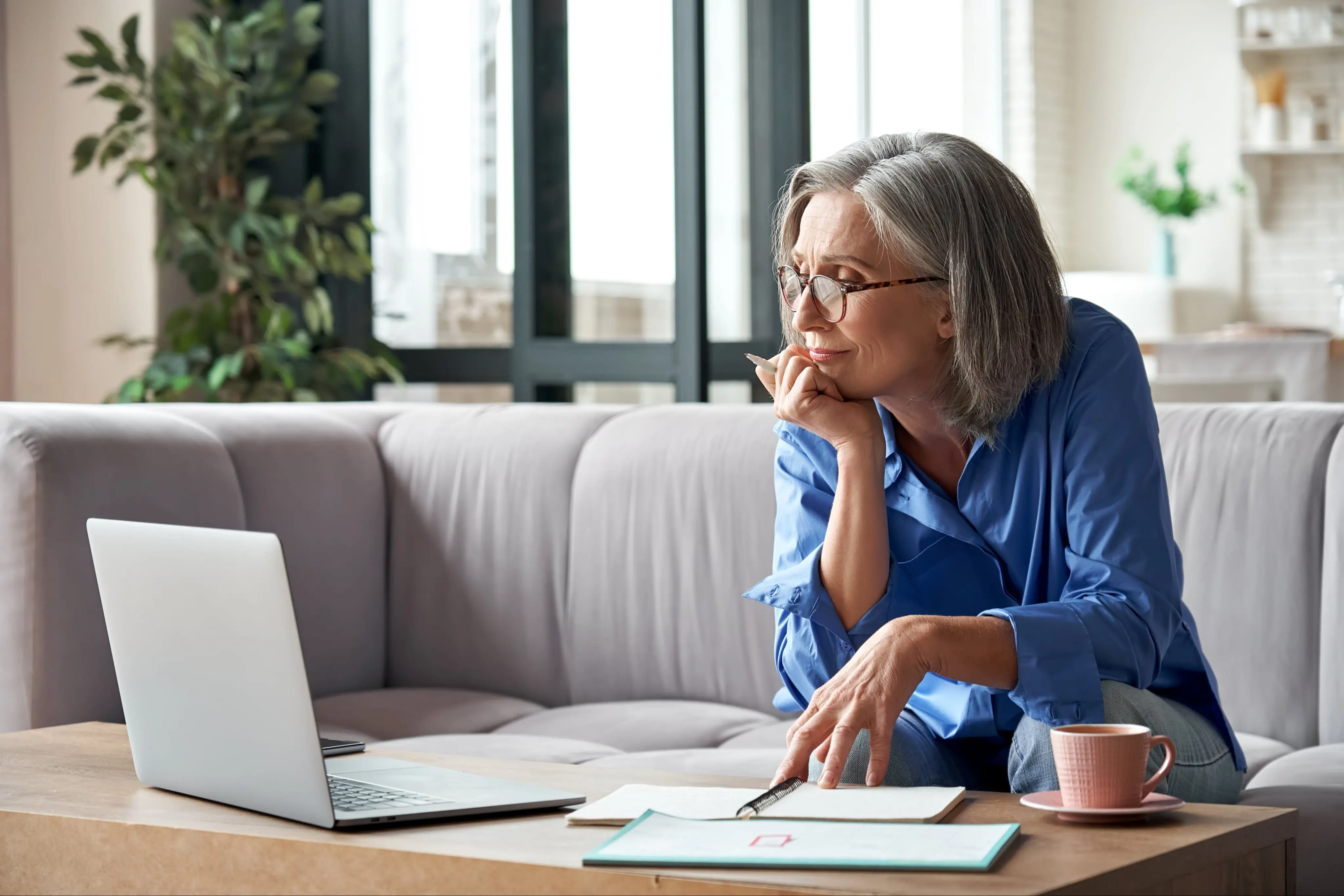 old woman looking on her laptop